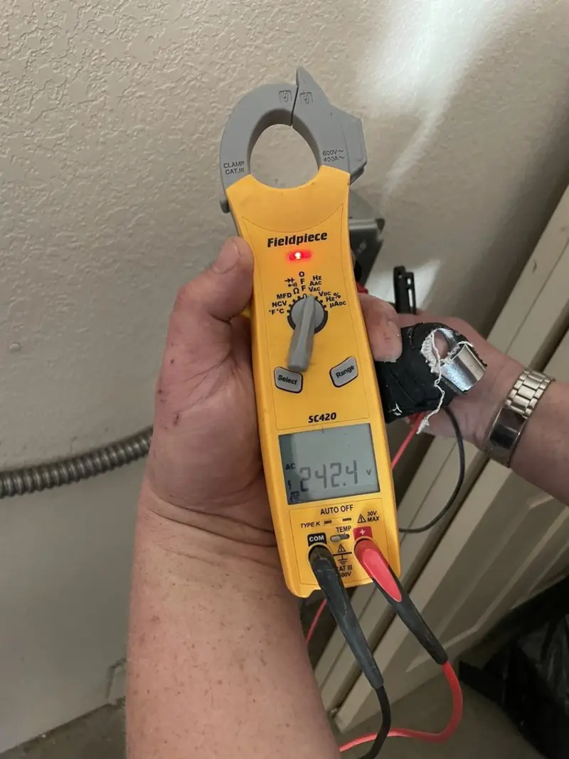 Voltage testing with clamp meter during Electrical Installation Services in Fairfax Station